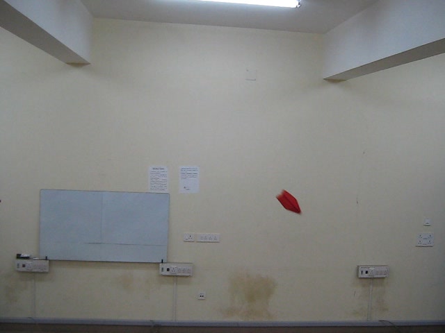 I have provided just one frame, wherein the paper plane made from red coloured paper is projected from a height